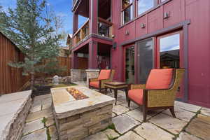 Patio / terrace featuring an outdoor fire pit, a fenced backyard, and a patio area