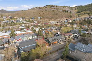 Aerial perspective of suburban area with a mountainous background