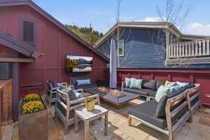 View of patio / terrace with an outdoor living space with a fire pit