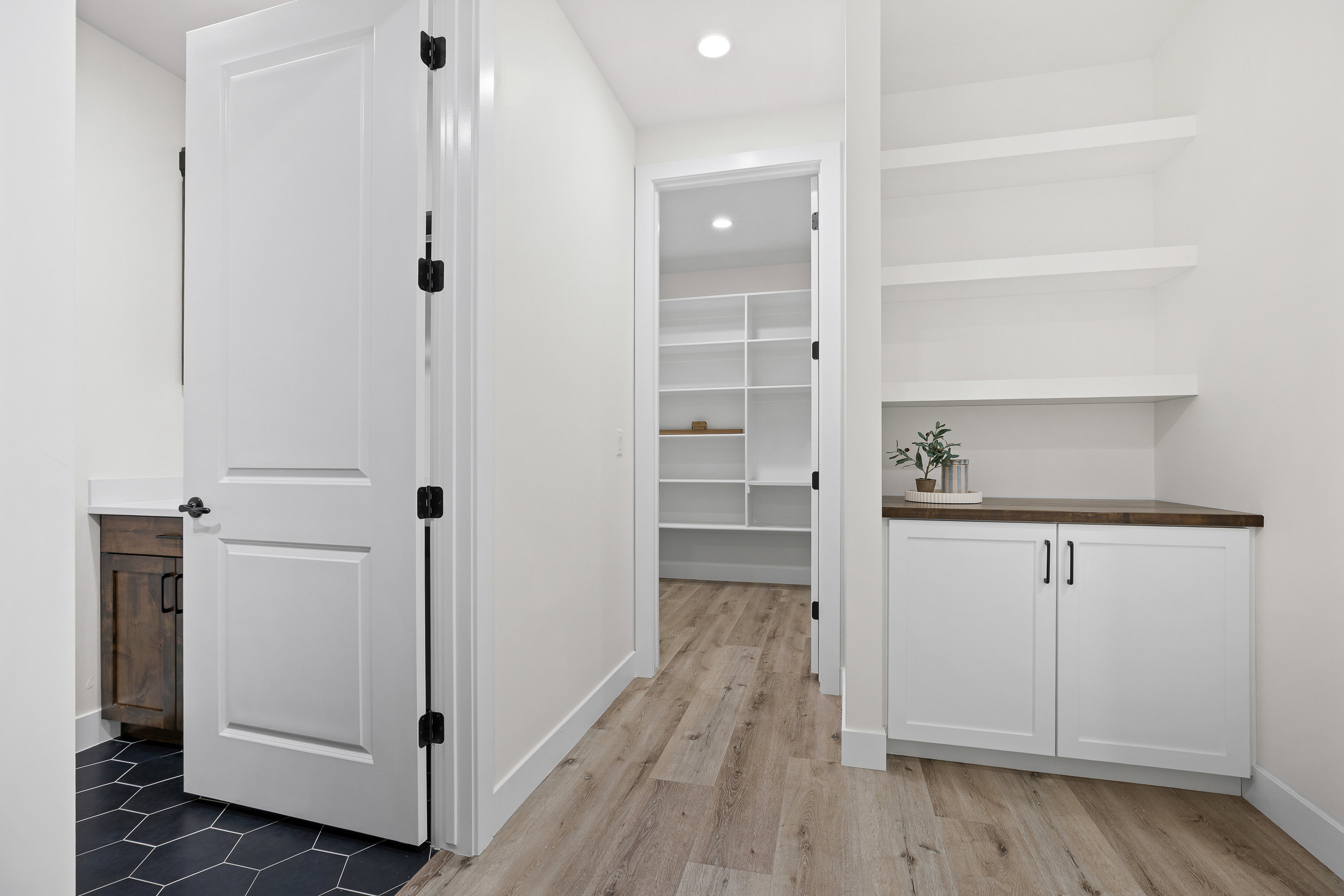 Hall with recessed lighting and light wood-style floors