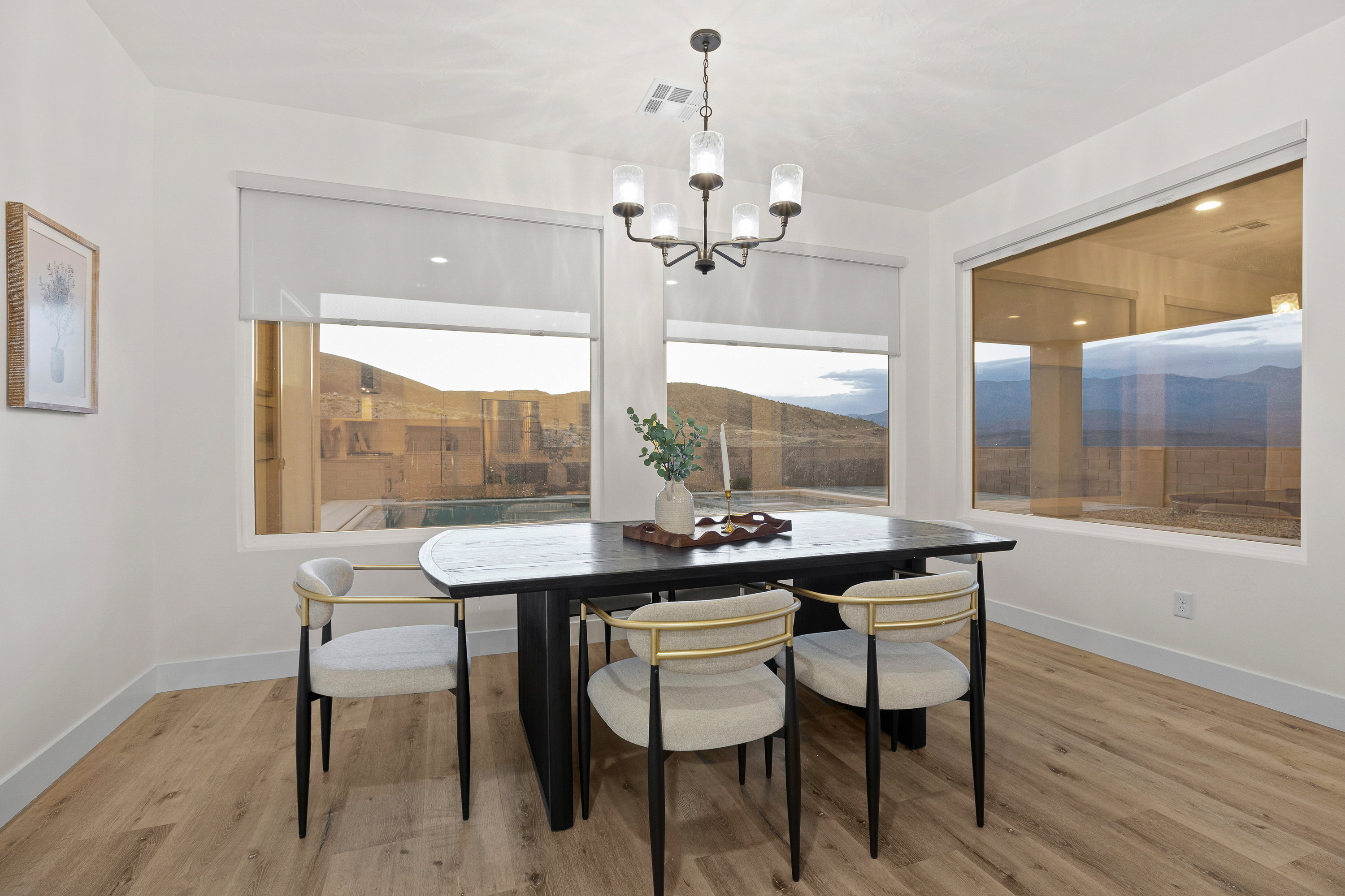 Dining room featuring light wood-style floors and hanging lights