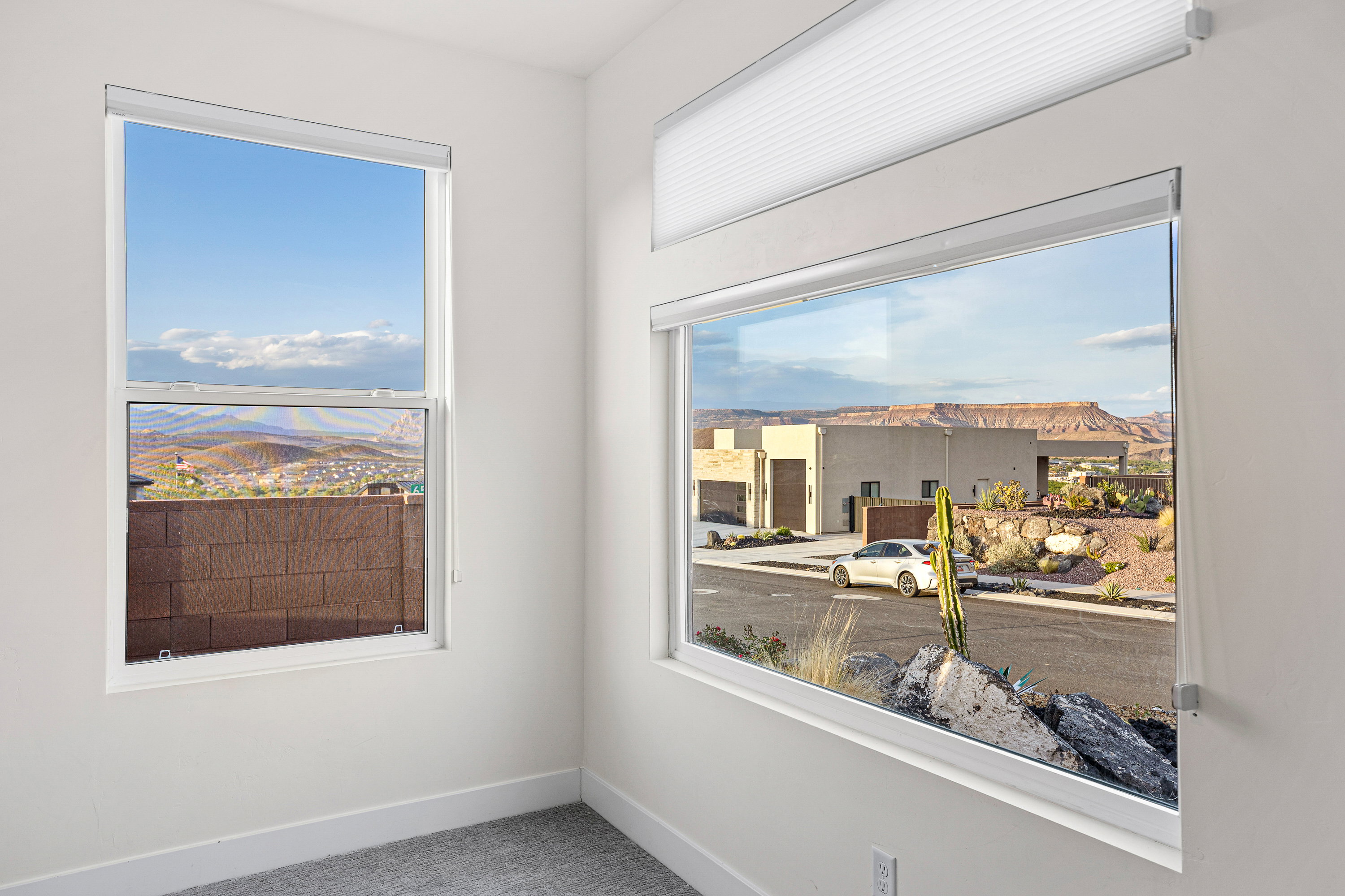 Spare room with carpet and a mountain view