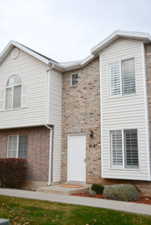 View of Front of Home with Brick and Siding