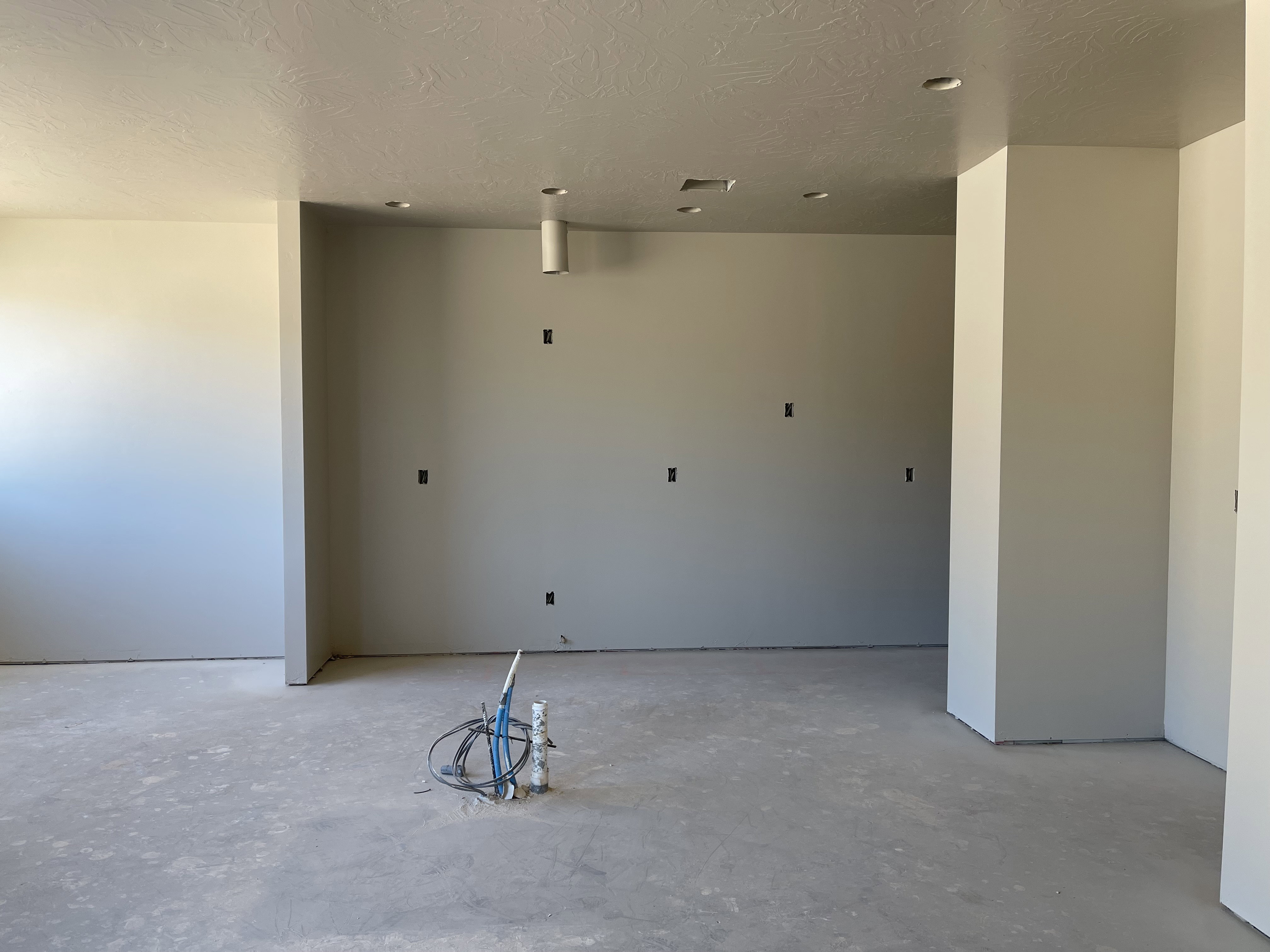 Spare room featuring concrete flooring and a textured ceiling