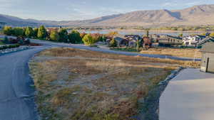 View of mountain background with a nearby body of water and nearby suburban area