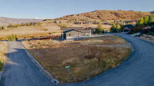 View of mountain backdrop with rural landscape