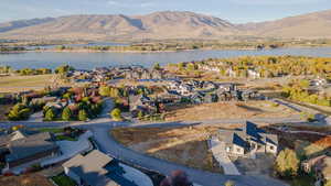Aerial perspective of suburban area with a water and mountain view