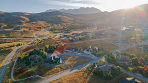 Aerial perspective of suburban area featuring a mountainous background