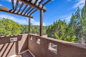 Balcony featuring a pergola