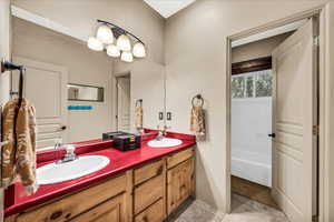 Full bathroom featuring double vanity
