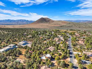Aerial view of residential area featuring a mountain backdrop
