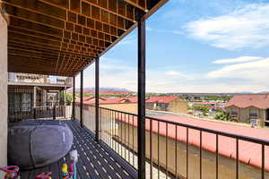 Balcony with a mountain view and a residential view