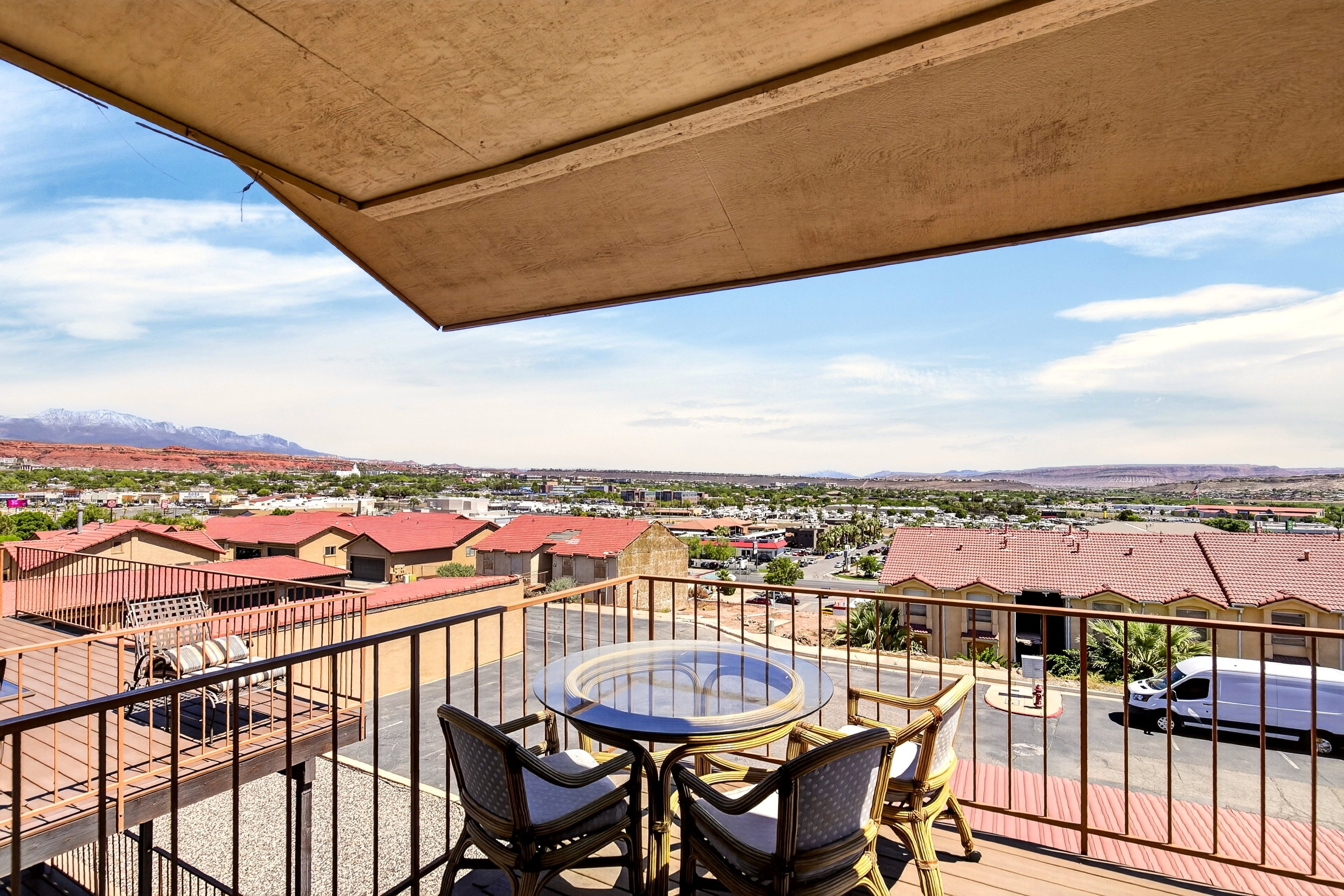 Balcony featuring a residential view and a mountain view