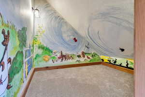 Recreation room with a textured ceiling