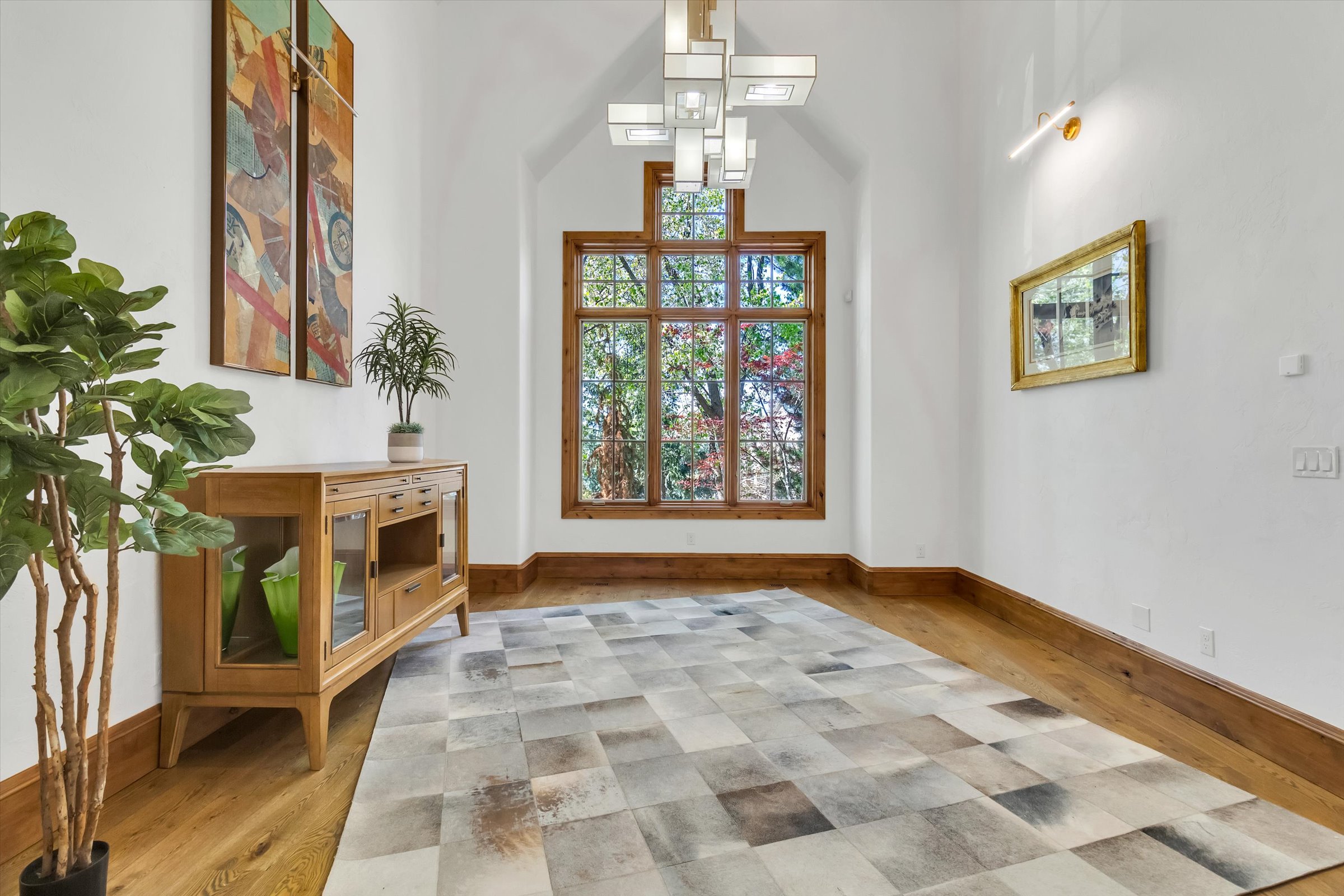 Formal dining or music room with vaulted ceiling.