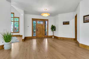 Foyer entrance featuring baseboards and light wood-style flooring
