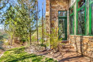 Property entrance with stone siding