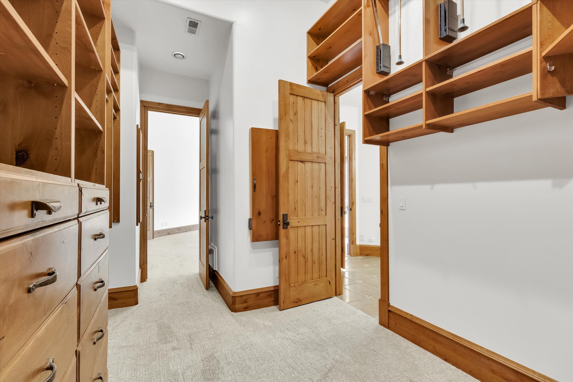 Walk-in closet has dual access points, and laundry chute.