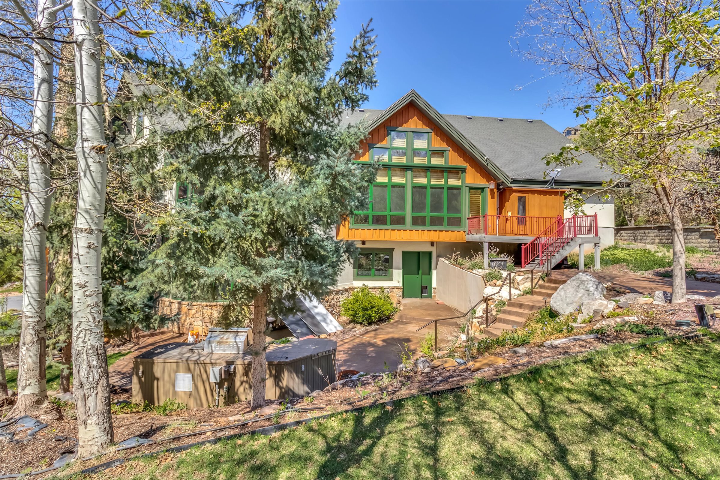 Large backyard terrace, perfect for outdoor entertaining. Easily access the kitchen, sport court, and Owner’s suite from entrances along the back of the house.