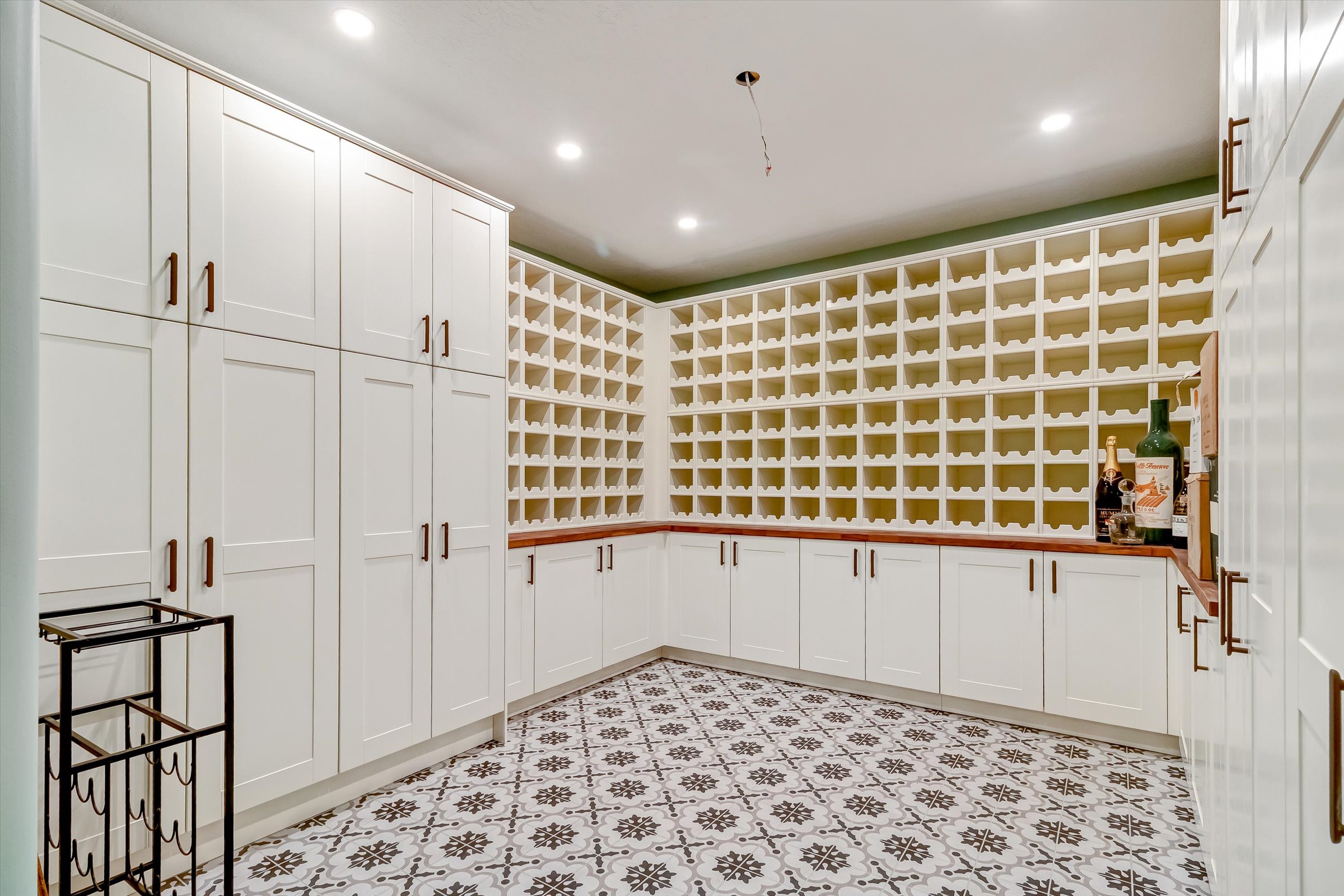 Impressive new, custom wine storage with large pantries.