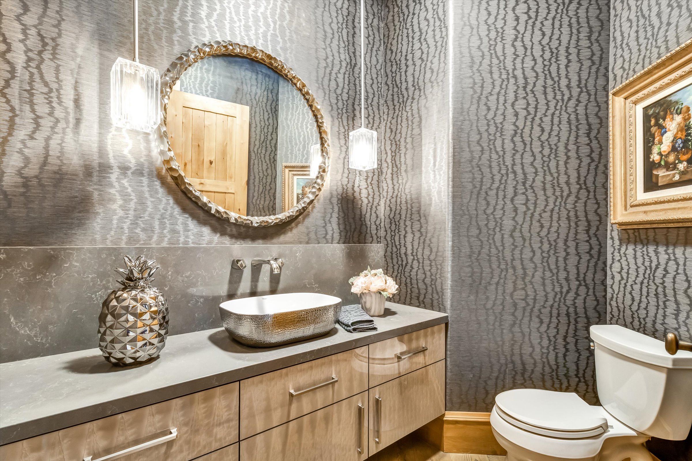 Glamorous powder room with custom finishes.