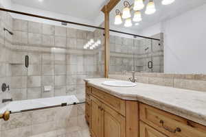 Bathroom with vanity and tiled shower / bath