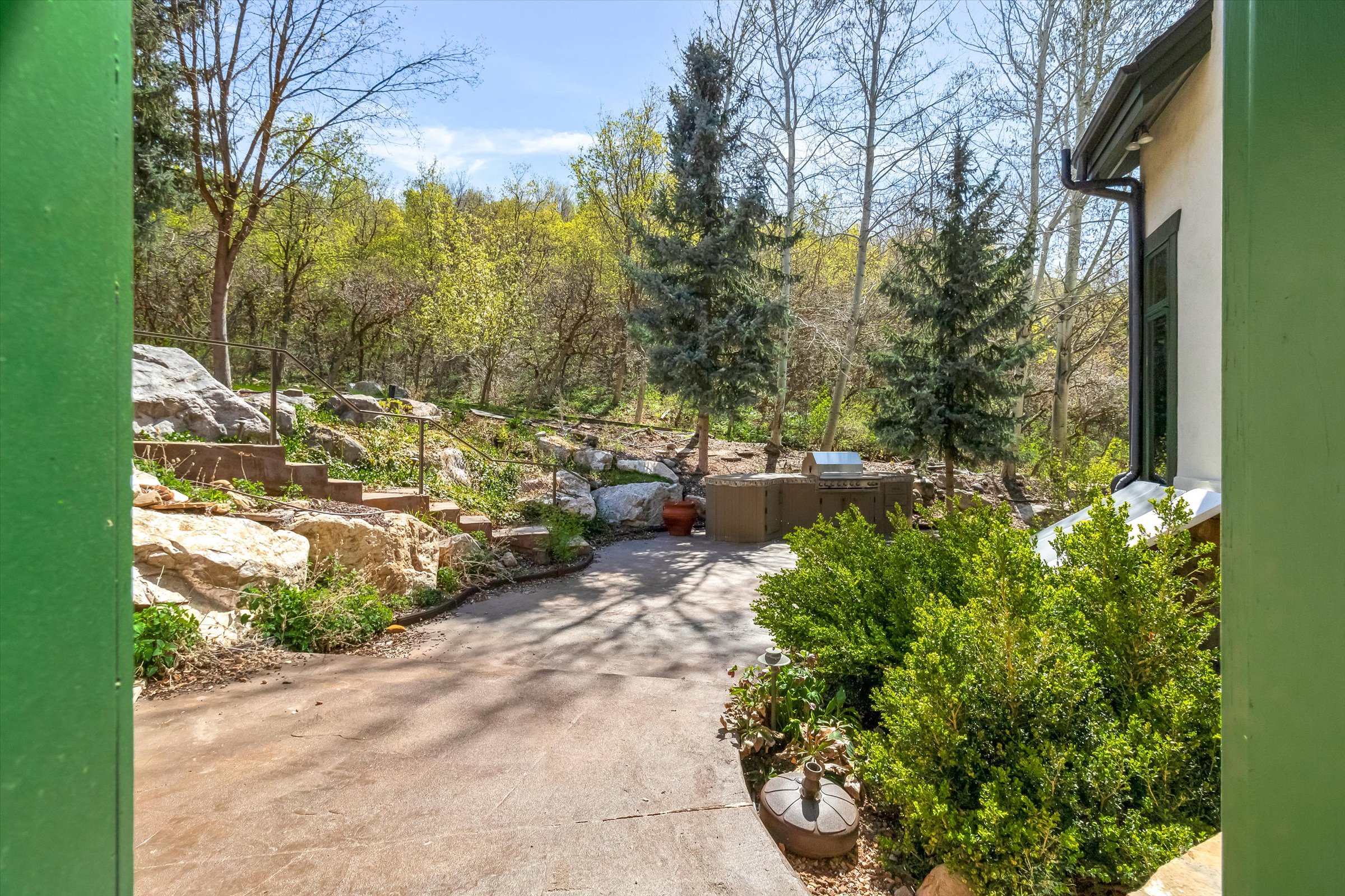 Designed for entertaining, the back yard offers many seating areas.