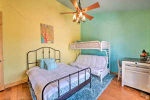 Bedroom with light wood-style flooring and ceiling fan