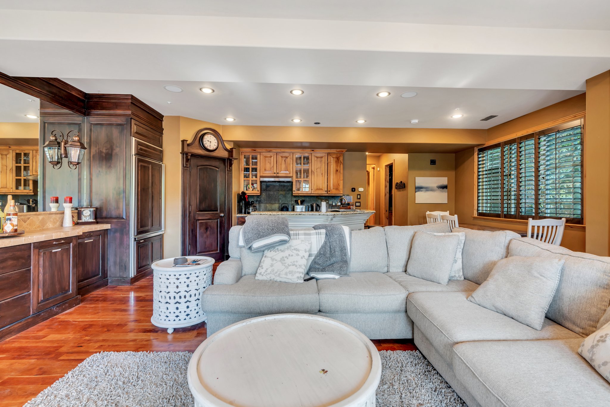 Living room with recessed lighting and wood finished floors