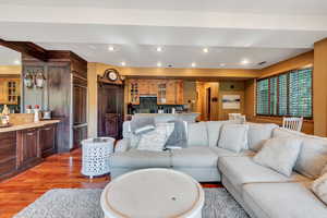 Living room with recessed lighting and wood finished floors