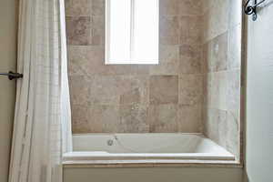 Bathroom featuring shower / bath combo