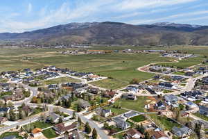 Aerial view of residential area featuring a mountainous background