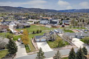 Aerial view of residential area featuring a mountainous background
