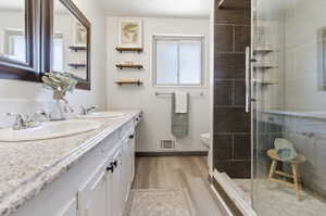Dual vanity with granite-look countertop and under-mount sinks