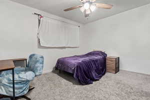 Bedroom featuring carpet floors and ceiling fan