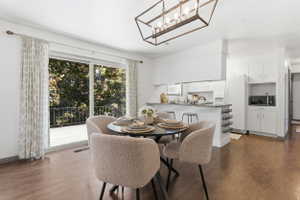 Open-concept living space with wood-finish flooring