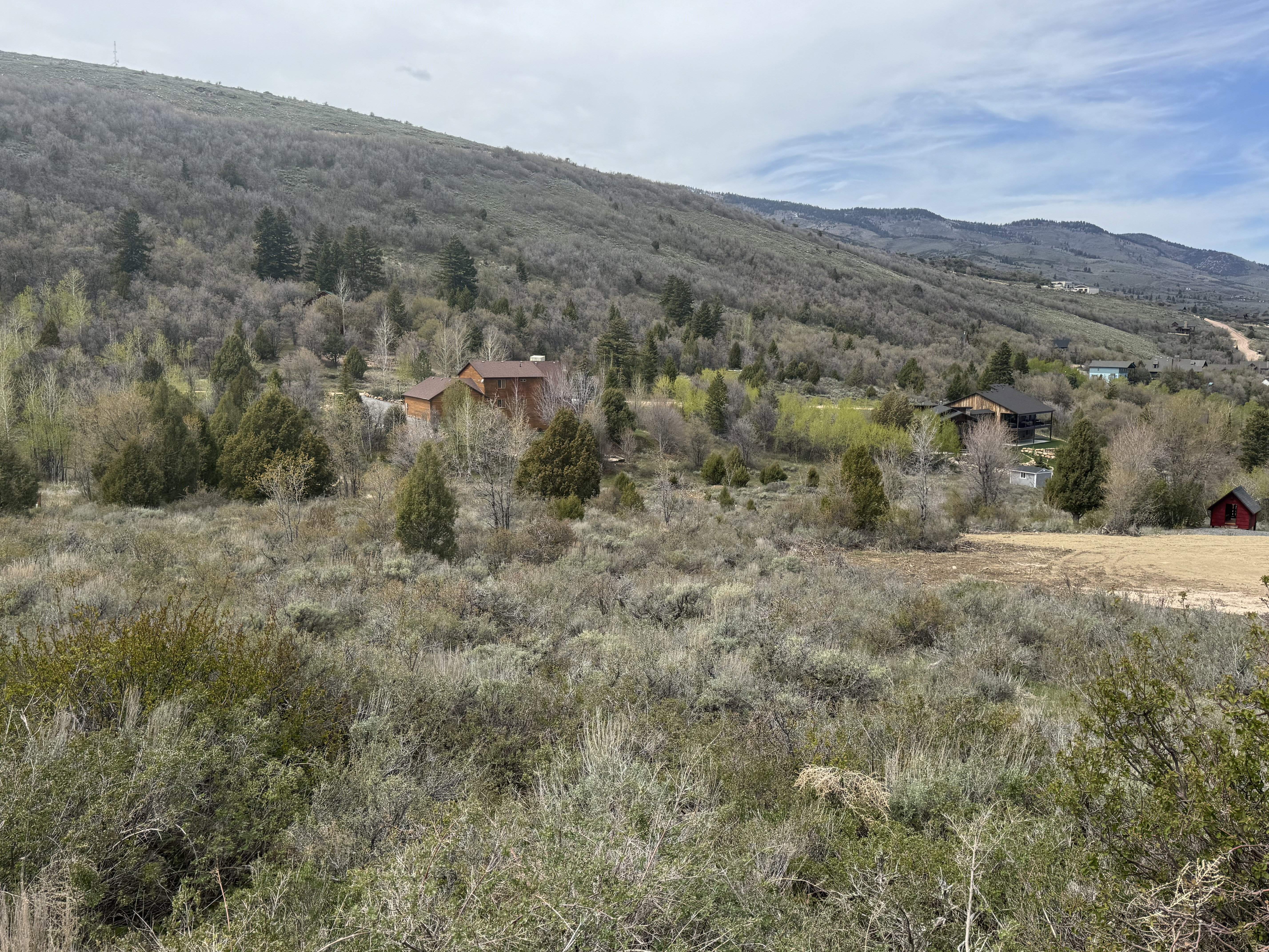 View of mountain backdrop featuring rural landscape