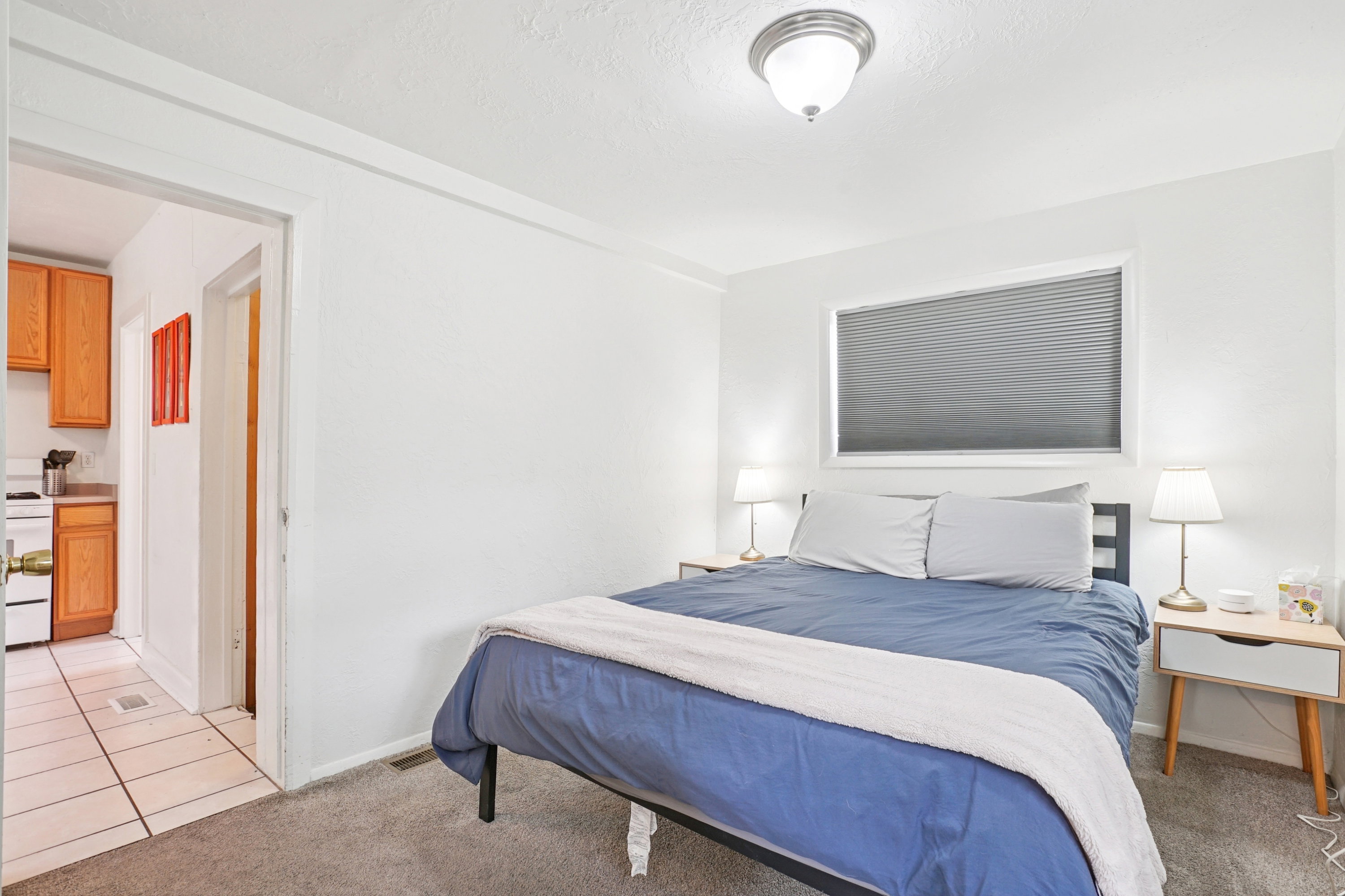 Bedroom featuring light carpet and light tile patterned flooring