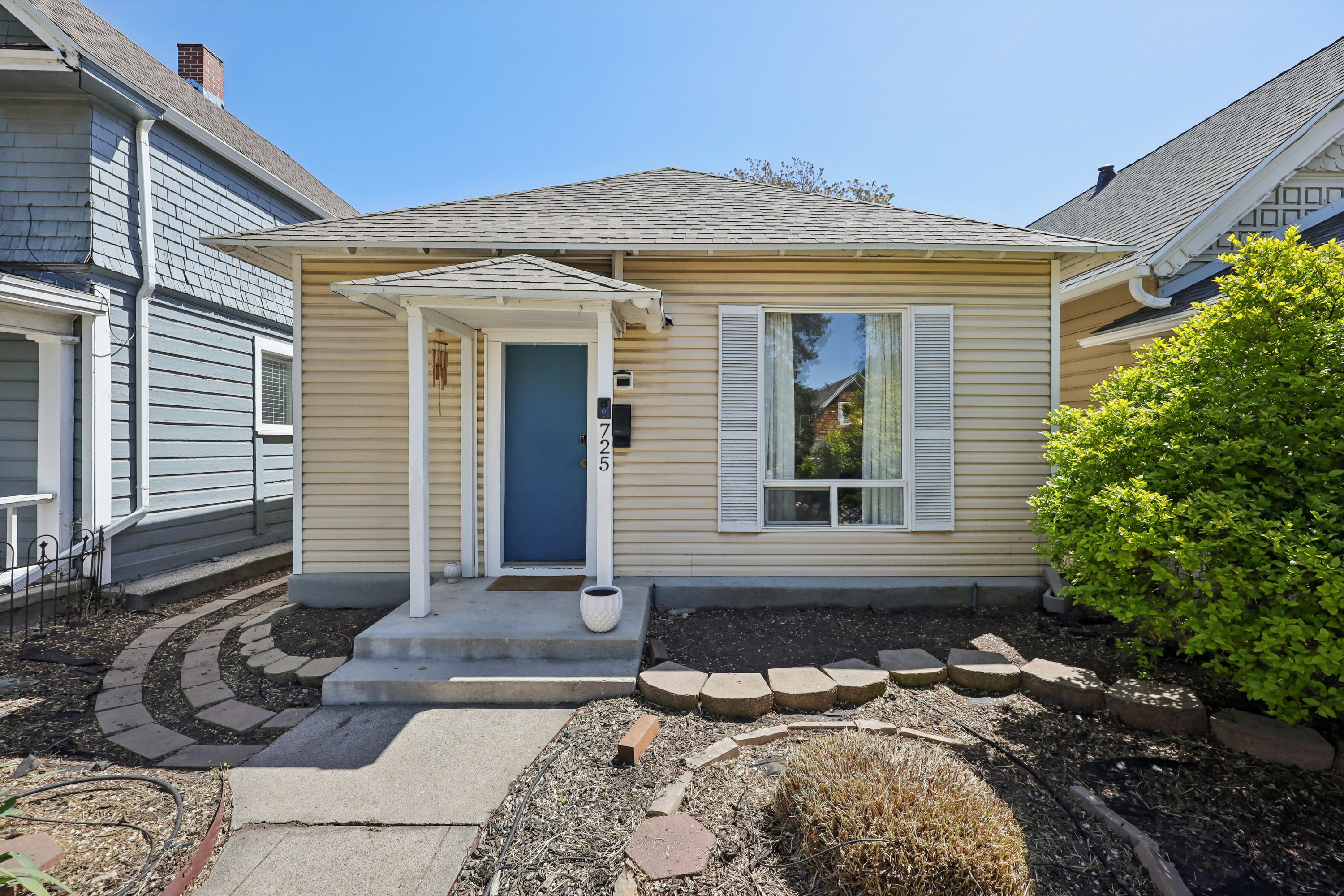 Property entrance with a shingled roof