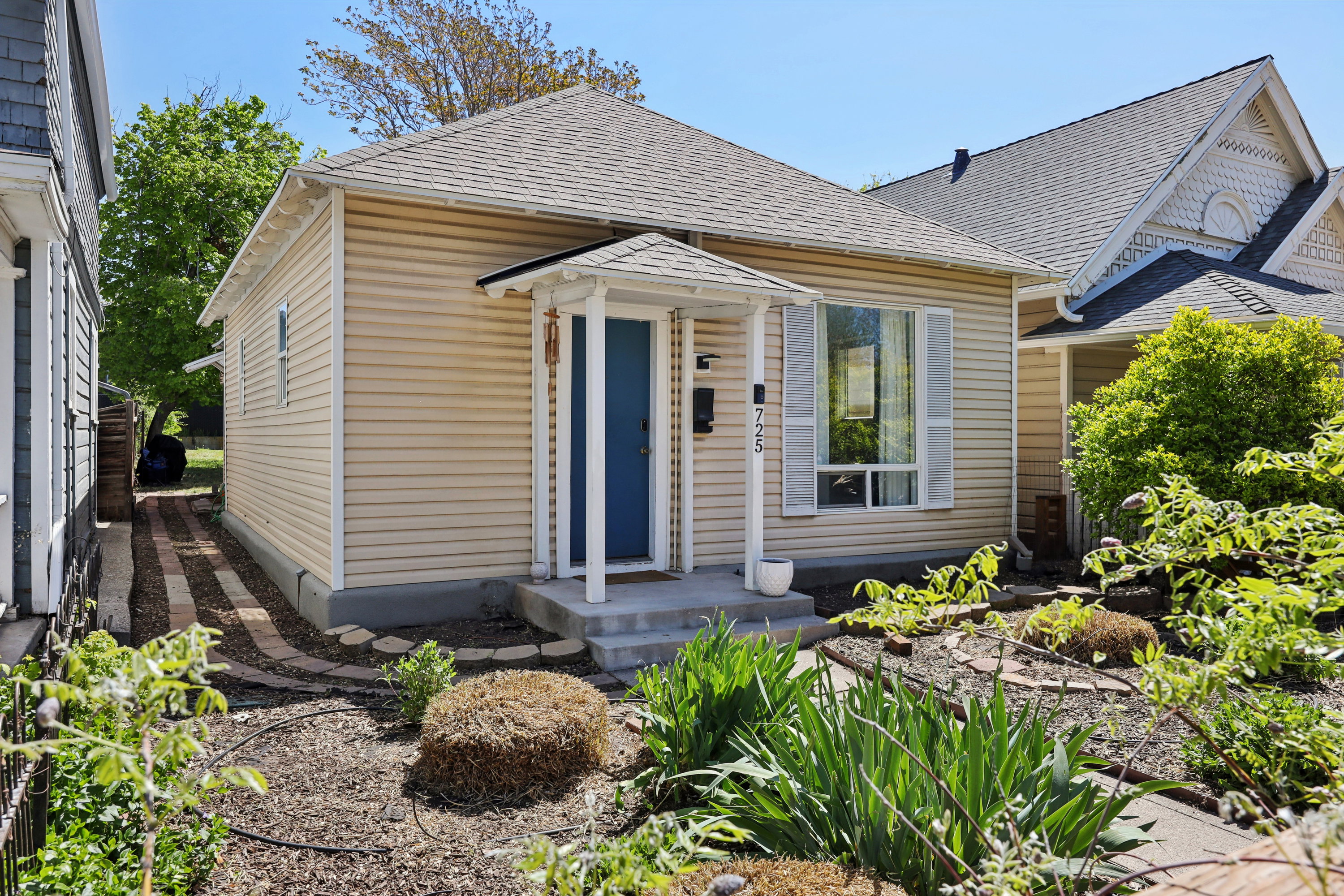 View of front of house featuring a shingled roof