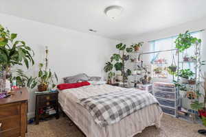 View of carpeted bedroom
