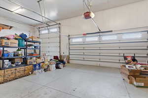 Garage featuring a garage door opener