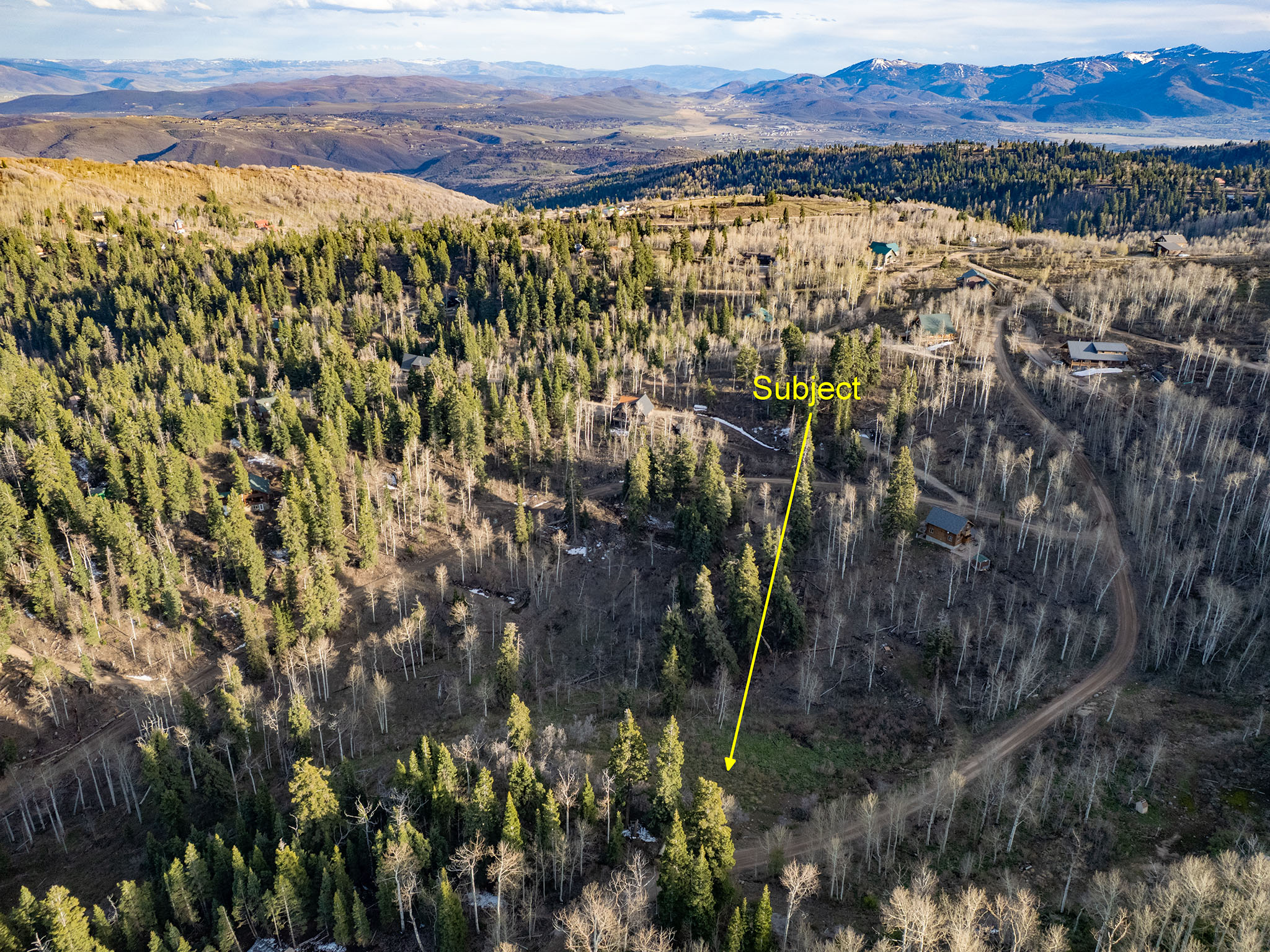 Aerial view of property's location with mountains and property boundaries highlighted