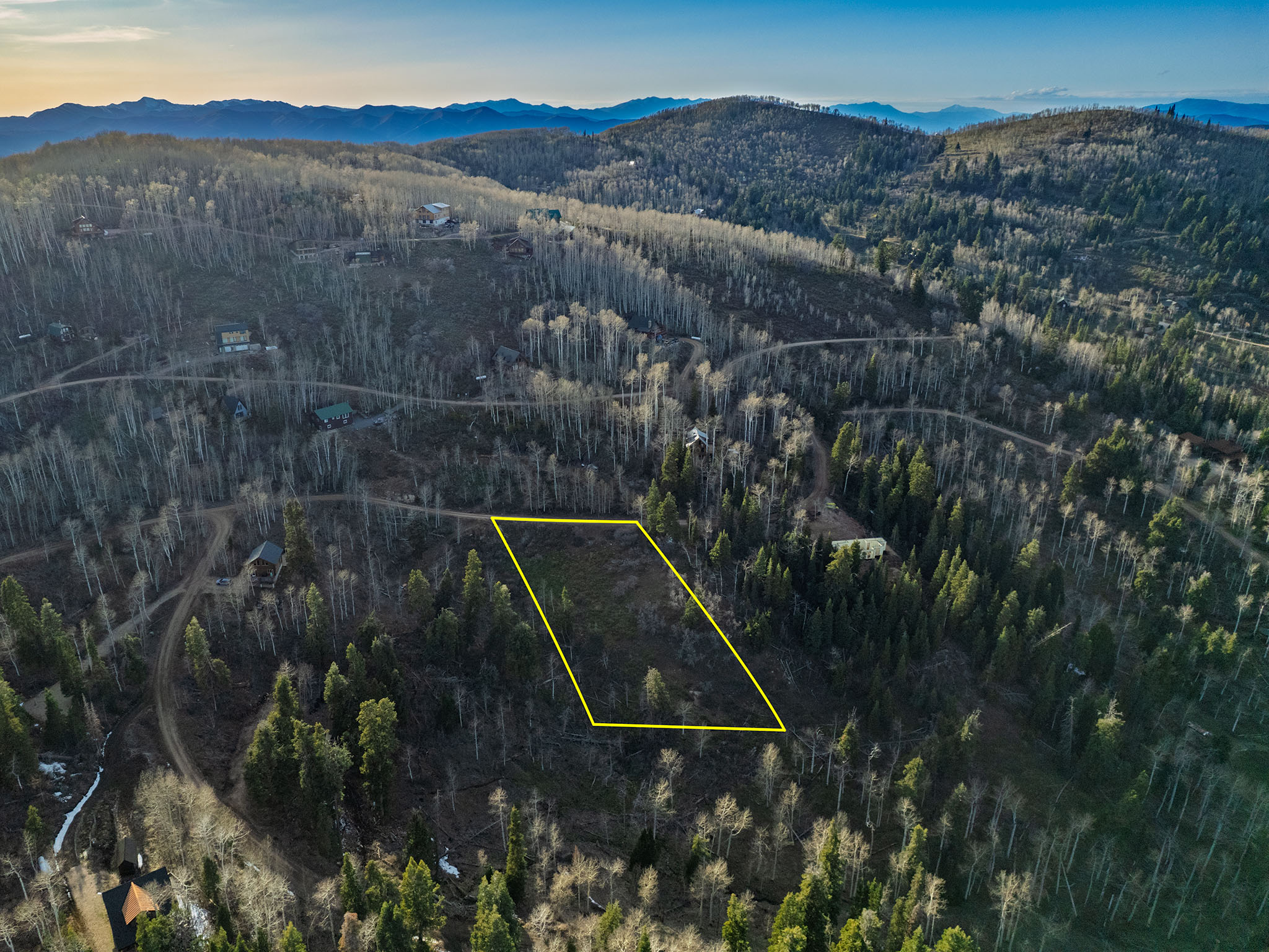 View of property location with a forest and property boundaries highlighted