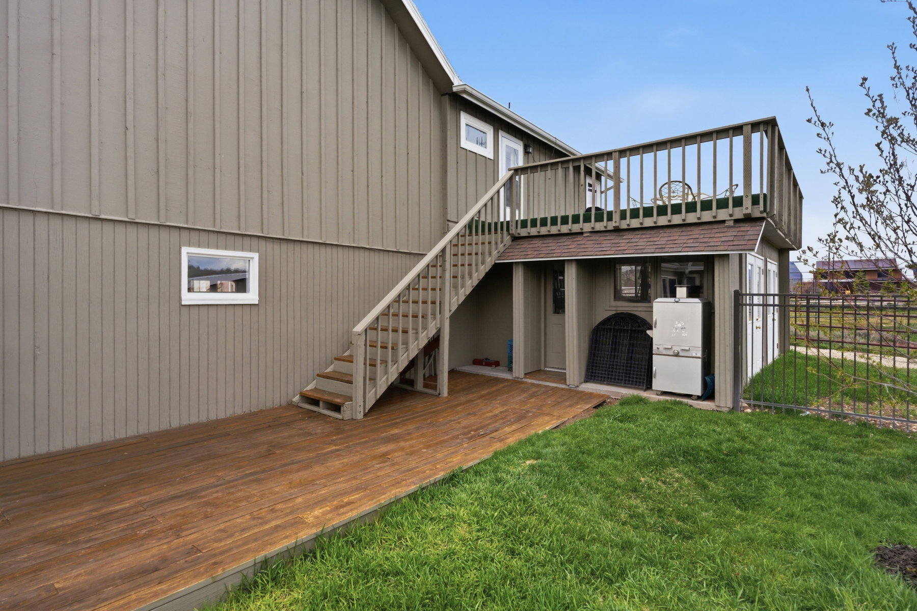 Rear view of property featuring a deck