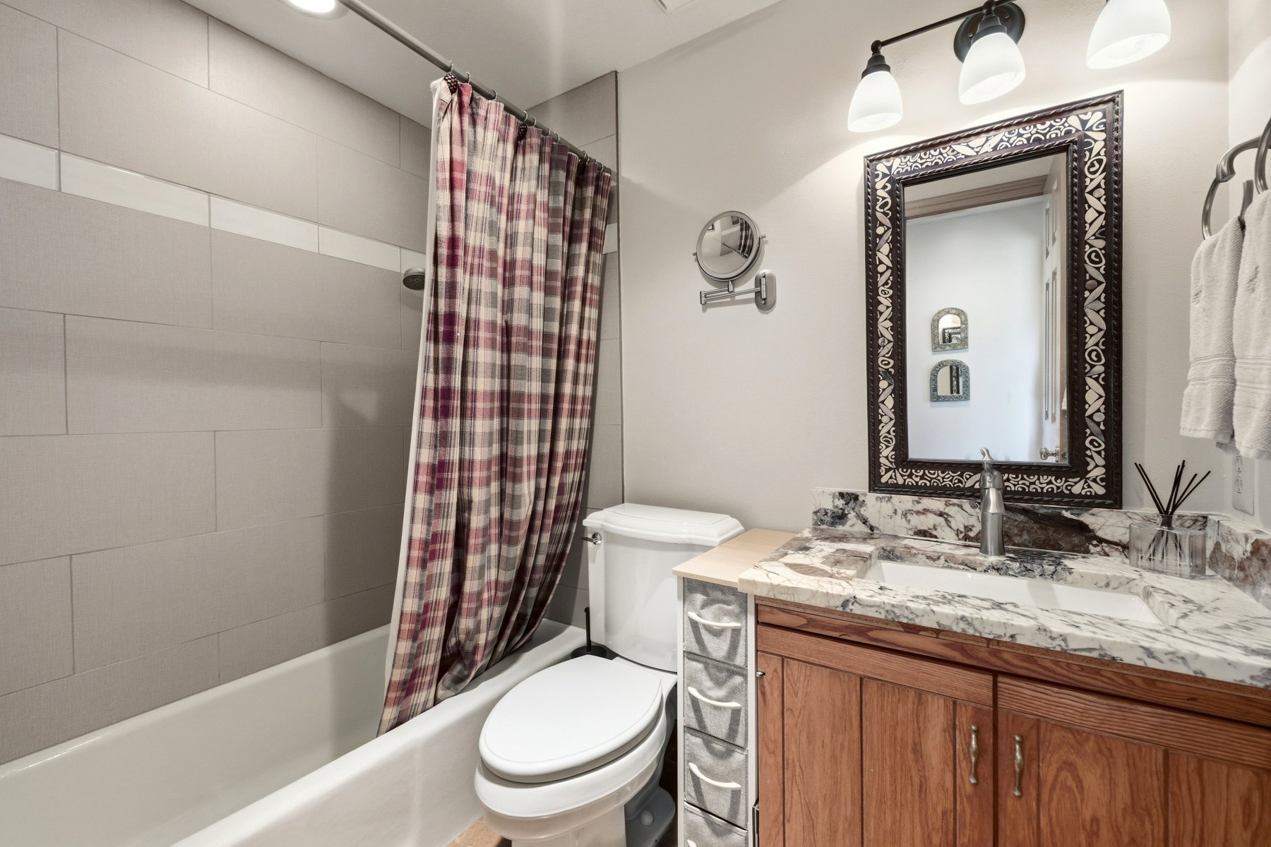 Bathroom with vanity and shower / tub combo