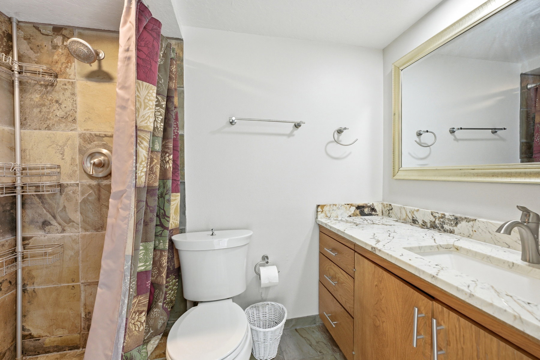 Bathroom featuring vanity and a stall shower
