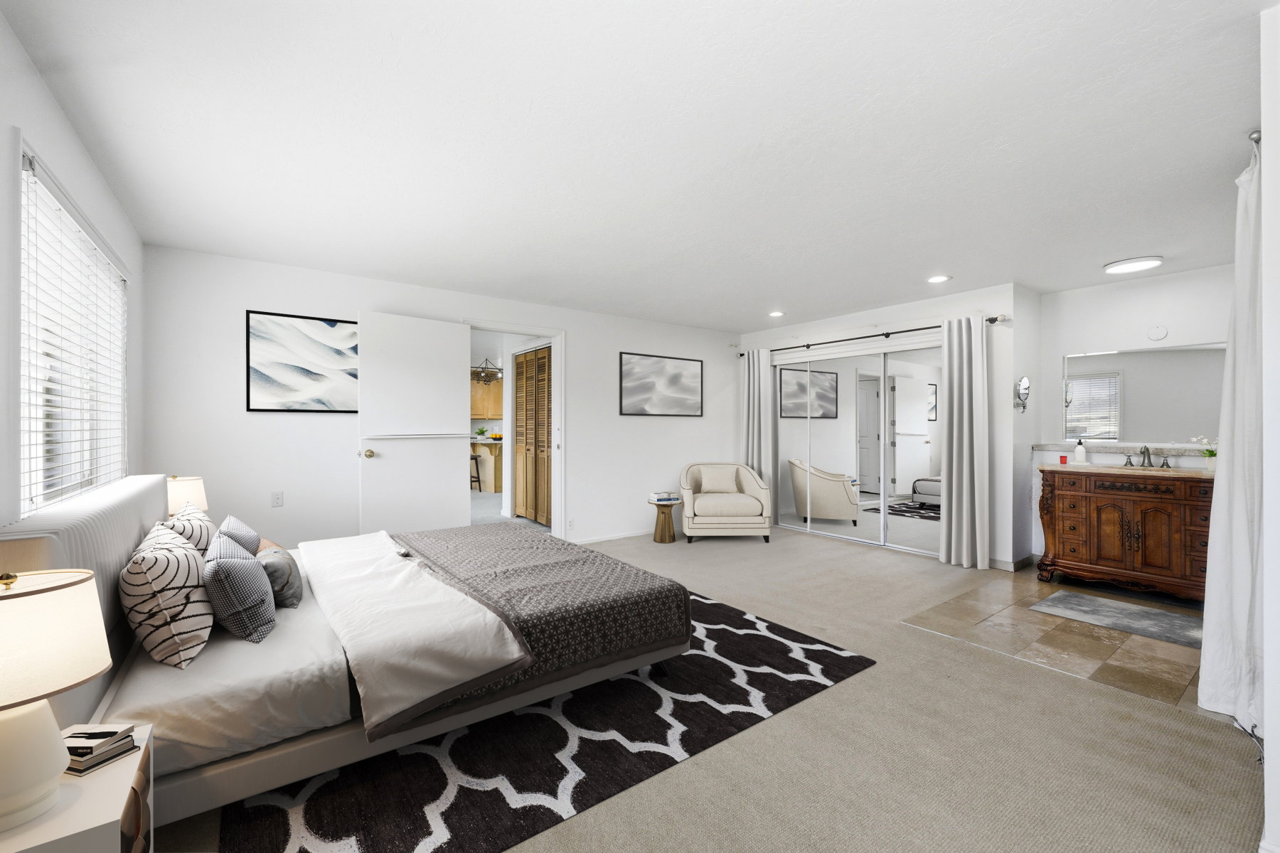 Bedroom with ensuite bath and carpet floors