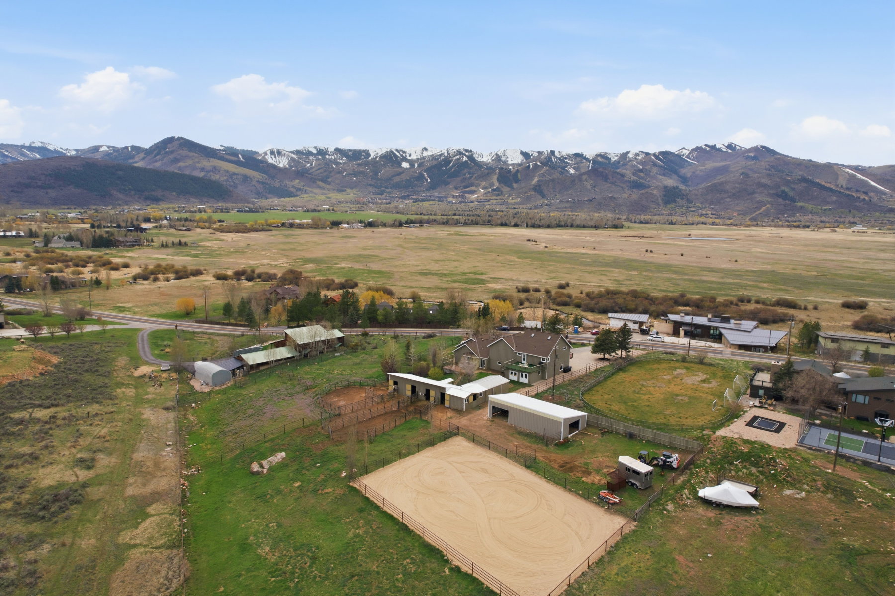 Aerial view of property's location featuring rural landscape and a mountainous background