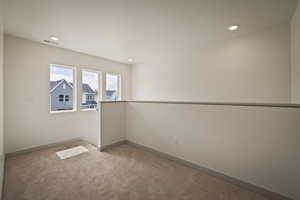 Spare room featuring carpet floors and recessed lighting